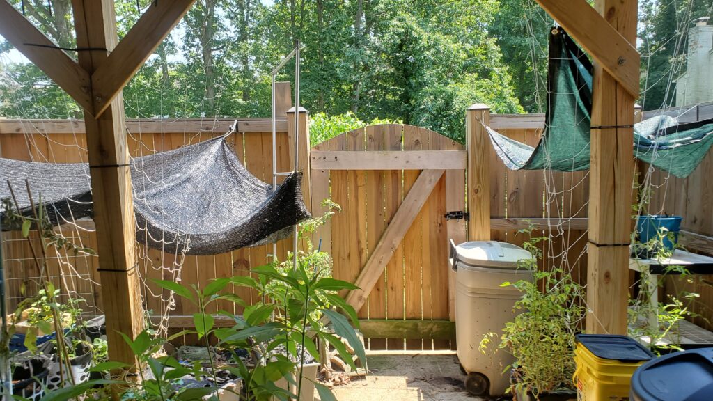 Sunshade on the left Repurposed dog kennel shade on the right. | Lilies and Tomatoes